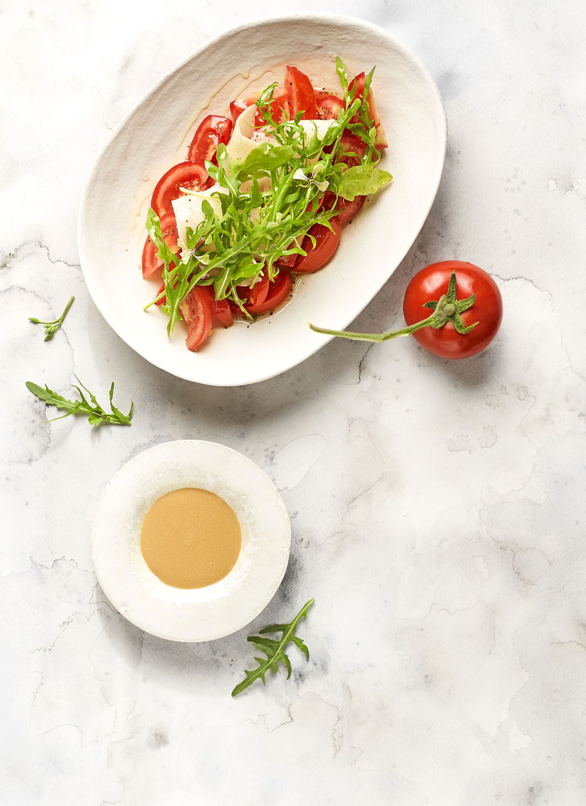 Amanida de tomàquet, ruca i parmesà