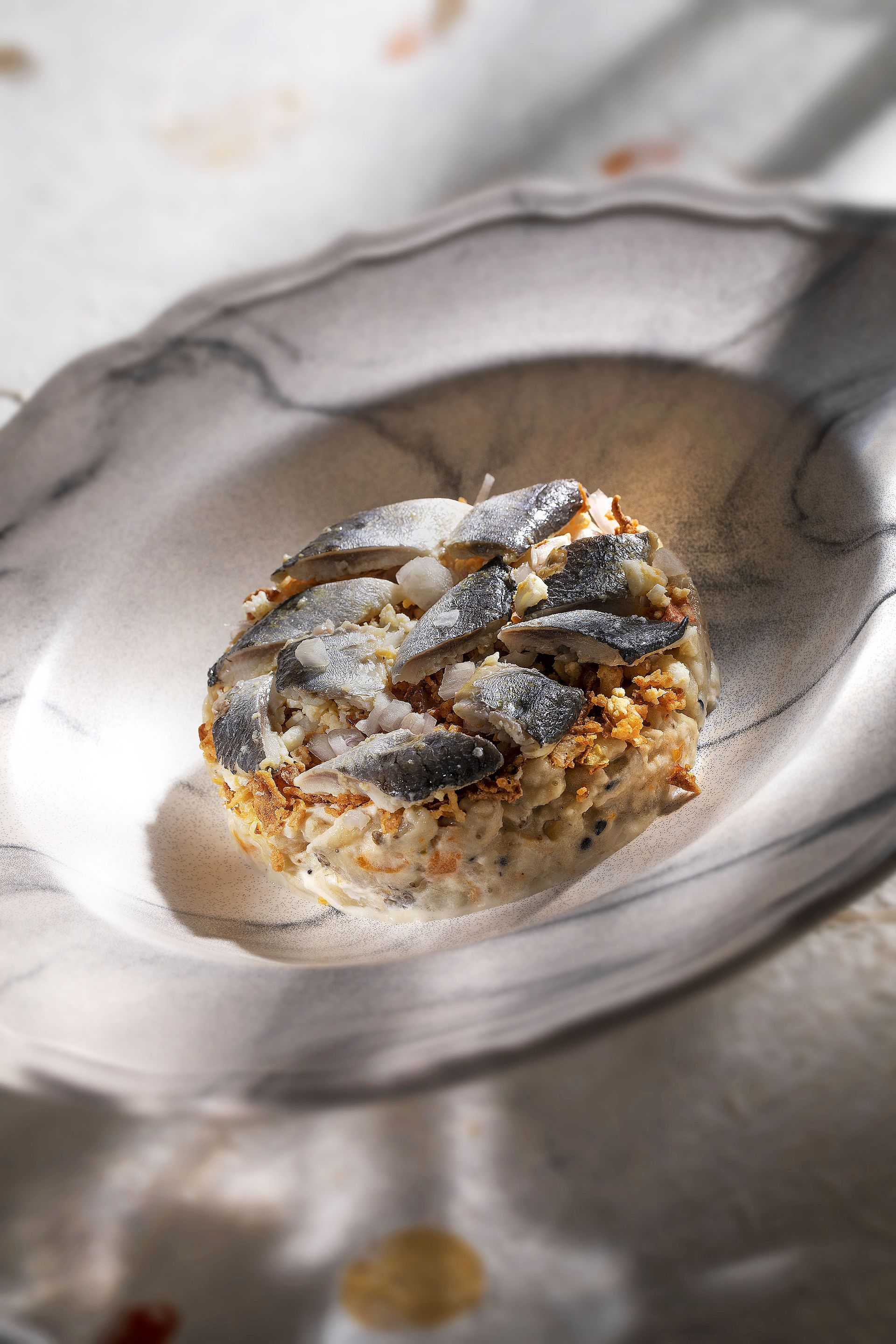 Ensaladilla d'albergínia fumada amb sardines