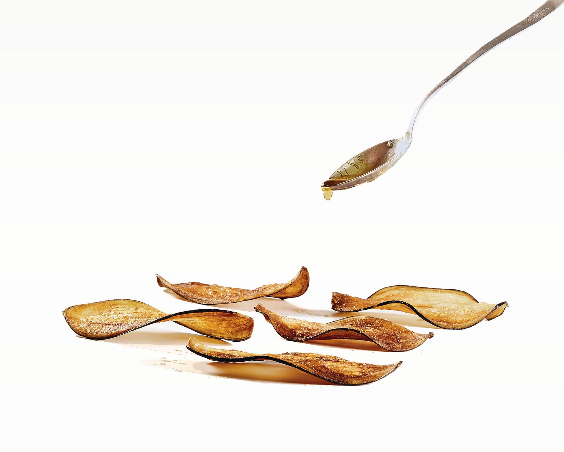 Xips d’albergínia amb mel de flors