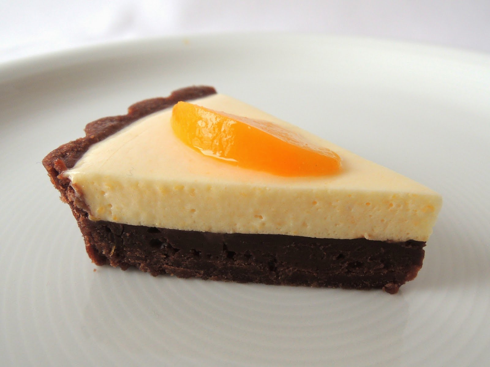 Pastís de xocolata, préssec i llimona