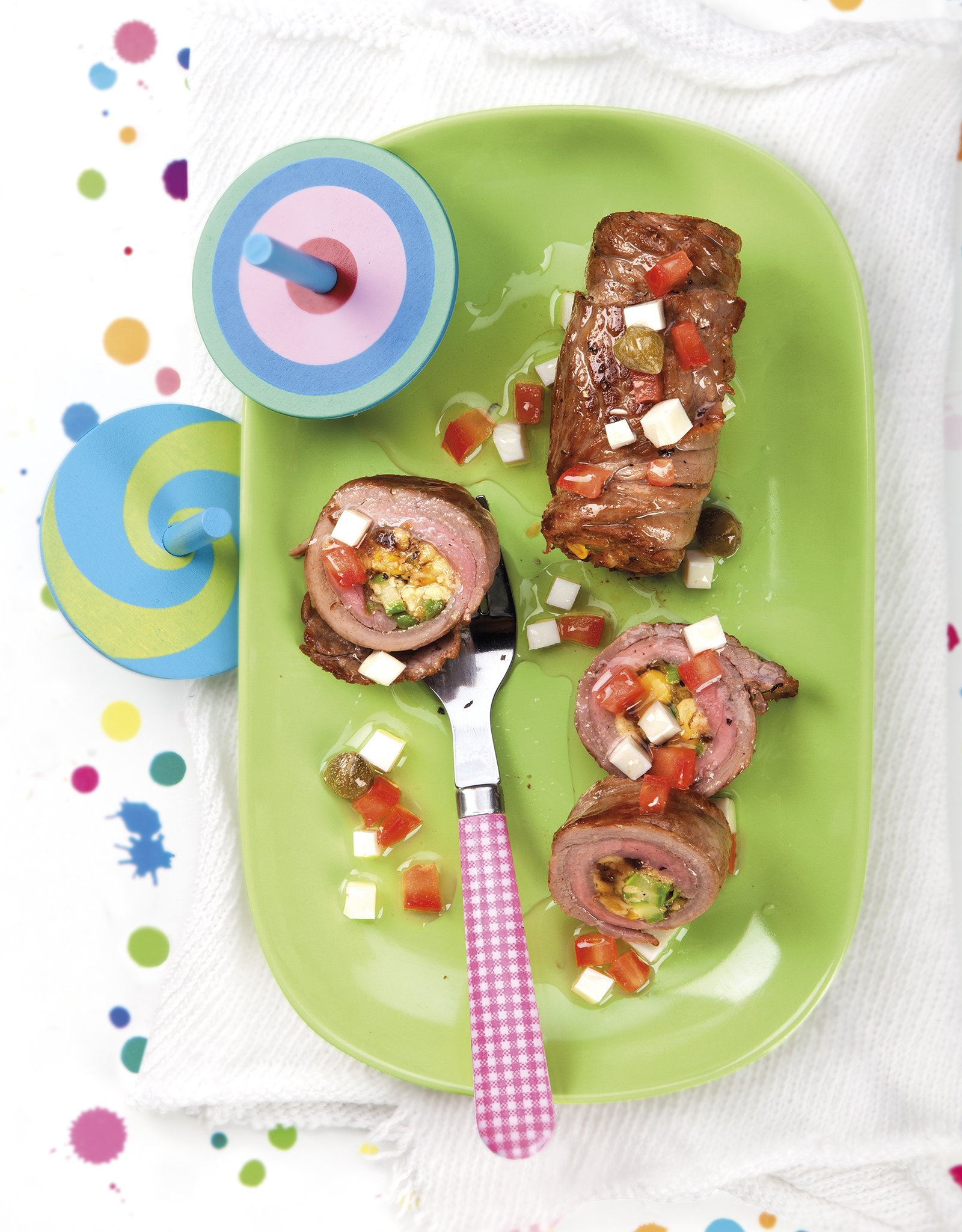 Involtini de ternera con espàrrecs verdes, pistachos y pasas