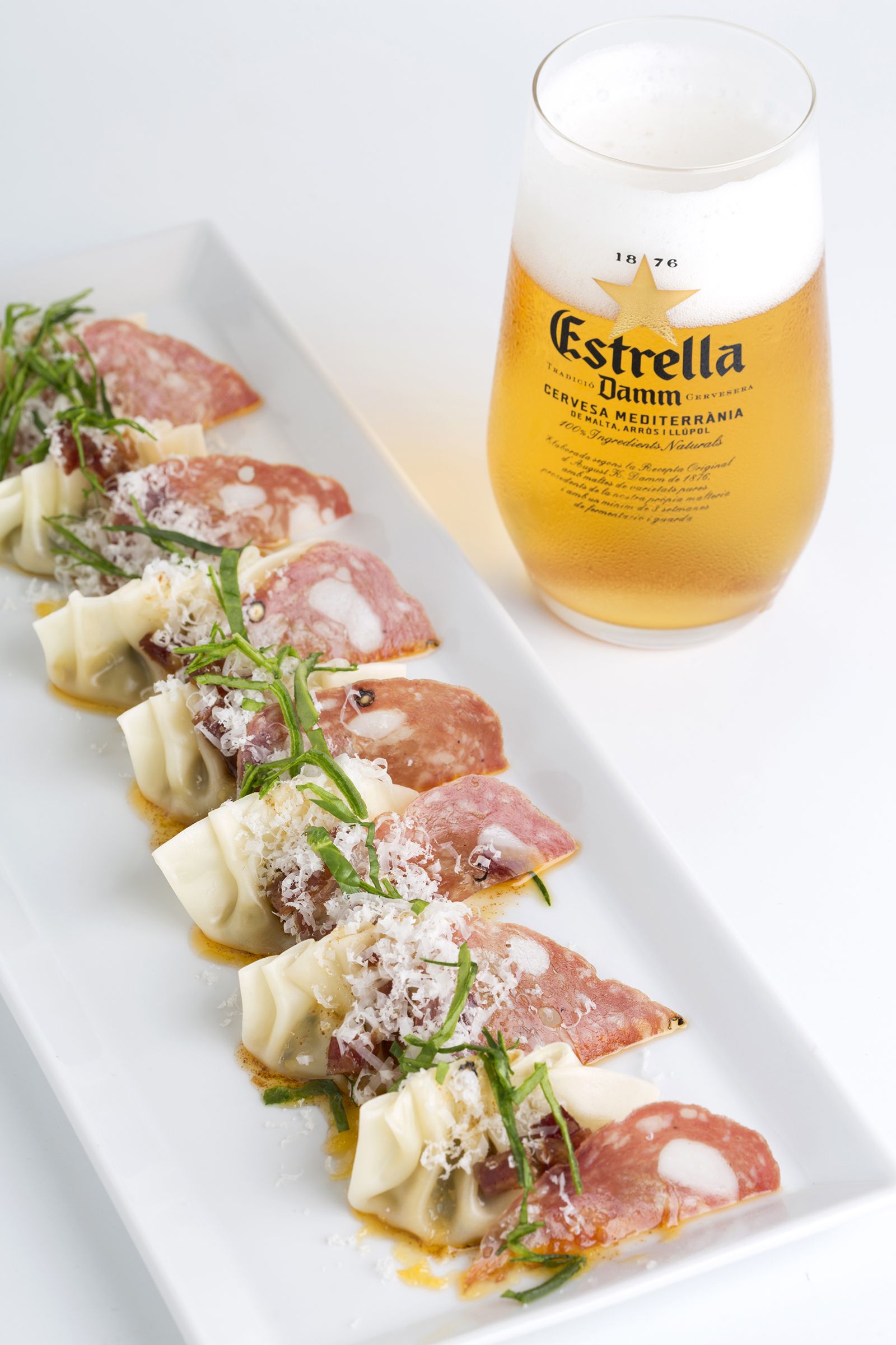 Farcellets de llonganissa en tres textures, carbassó i parmesà (IGP Llonganissa de Vic)